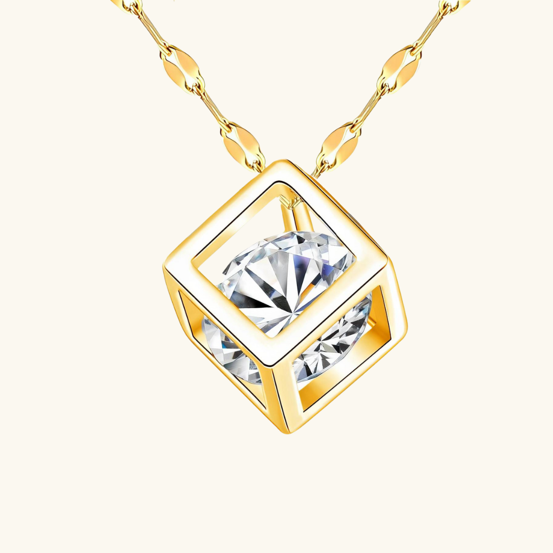 Gold necklace with a diamond pendant on a white background