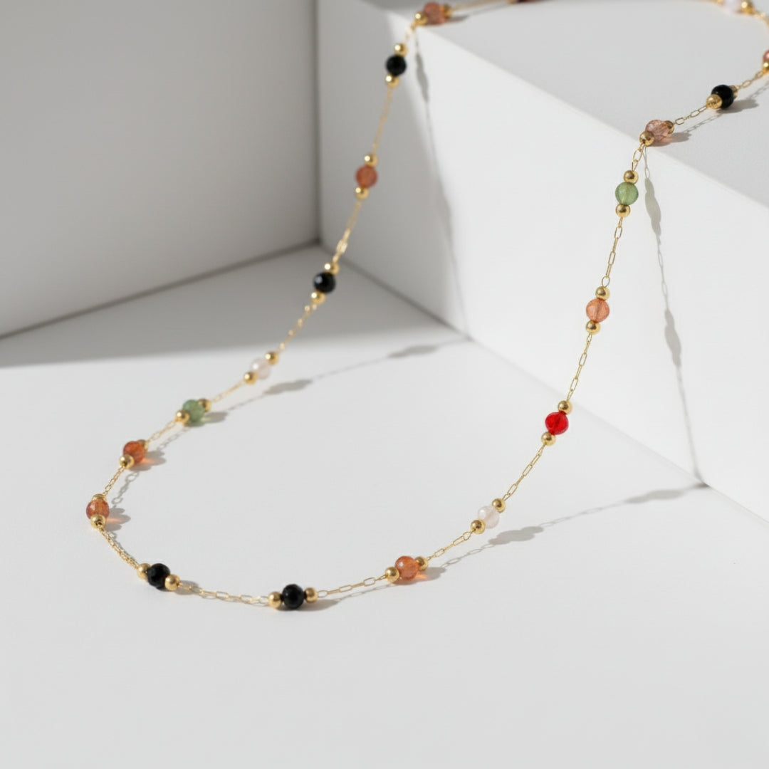 Necklace with multicolored beads on a white background