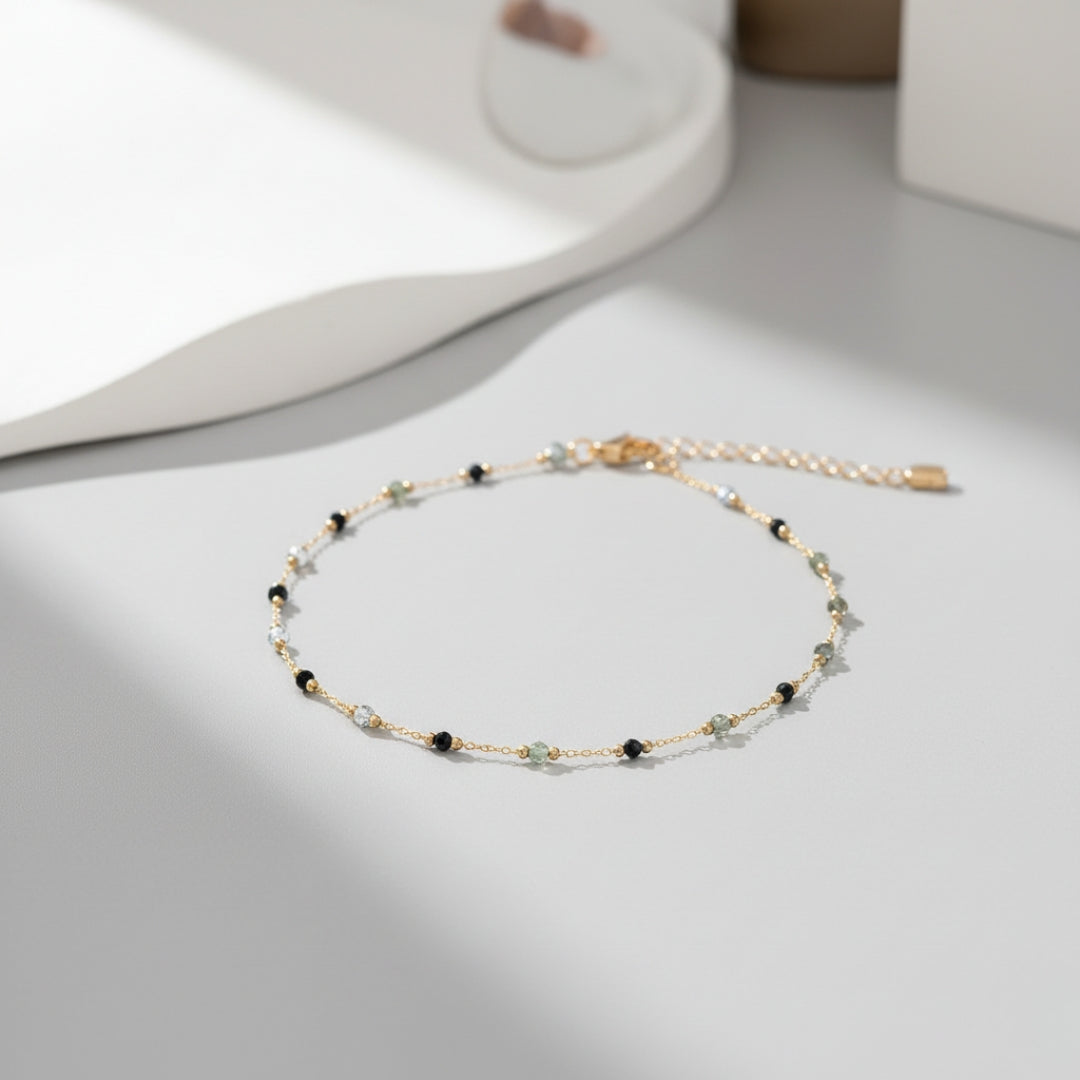 Delicate beaded bracelet on a light gray surface