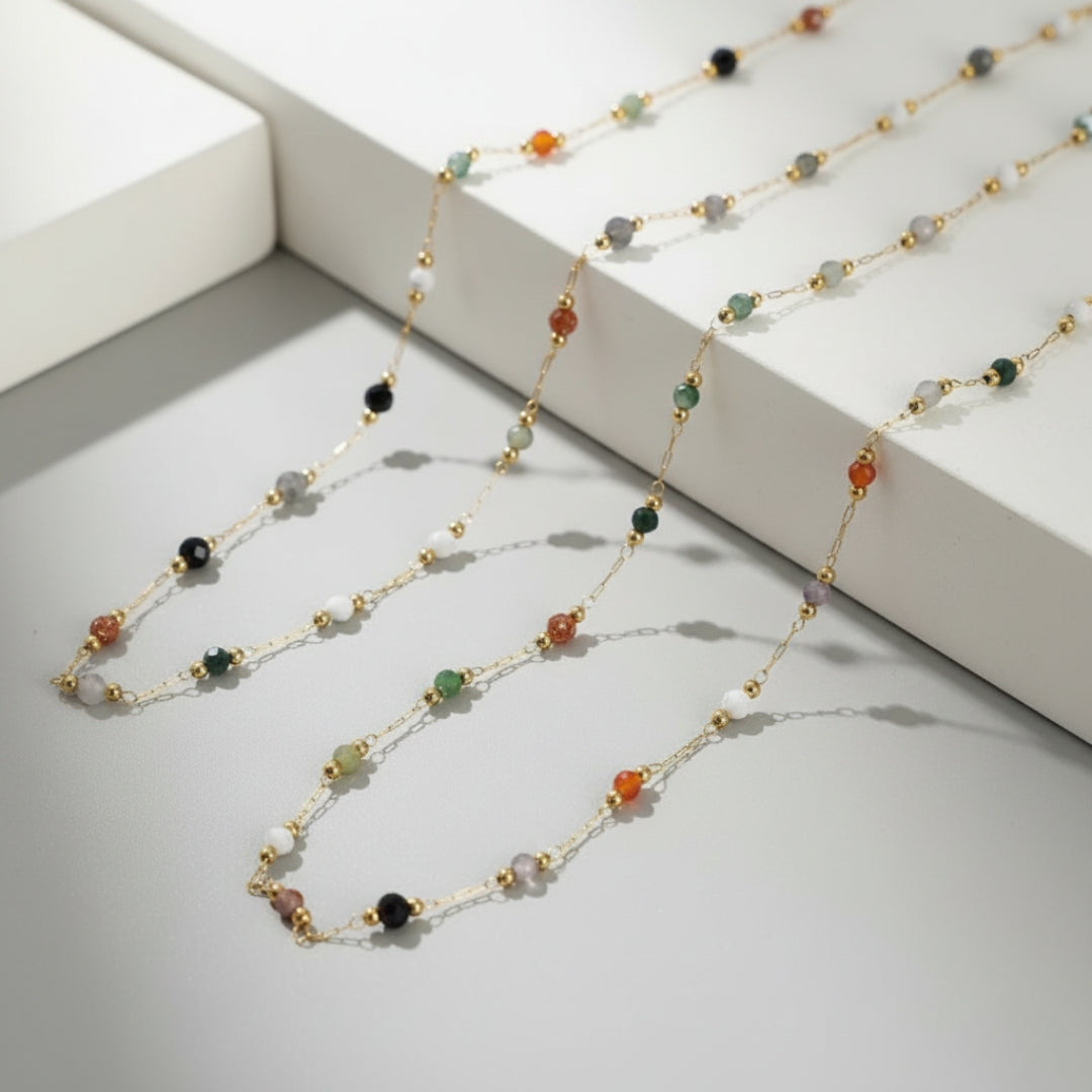 Necklace with multicolored beads on a light gray surface