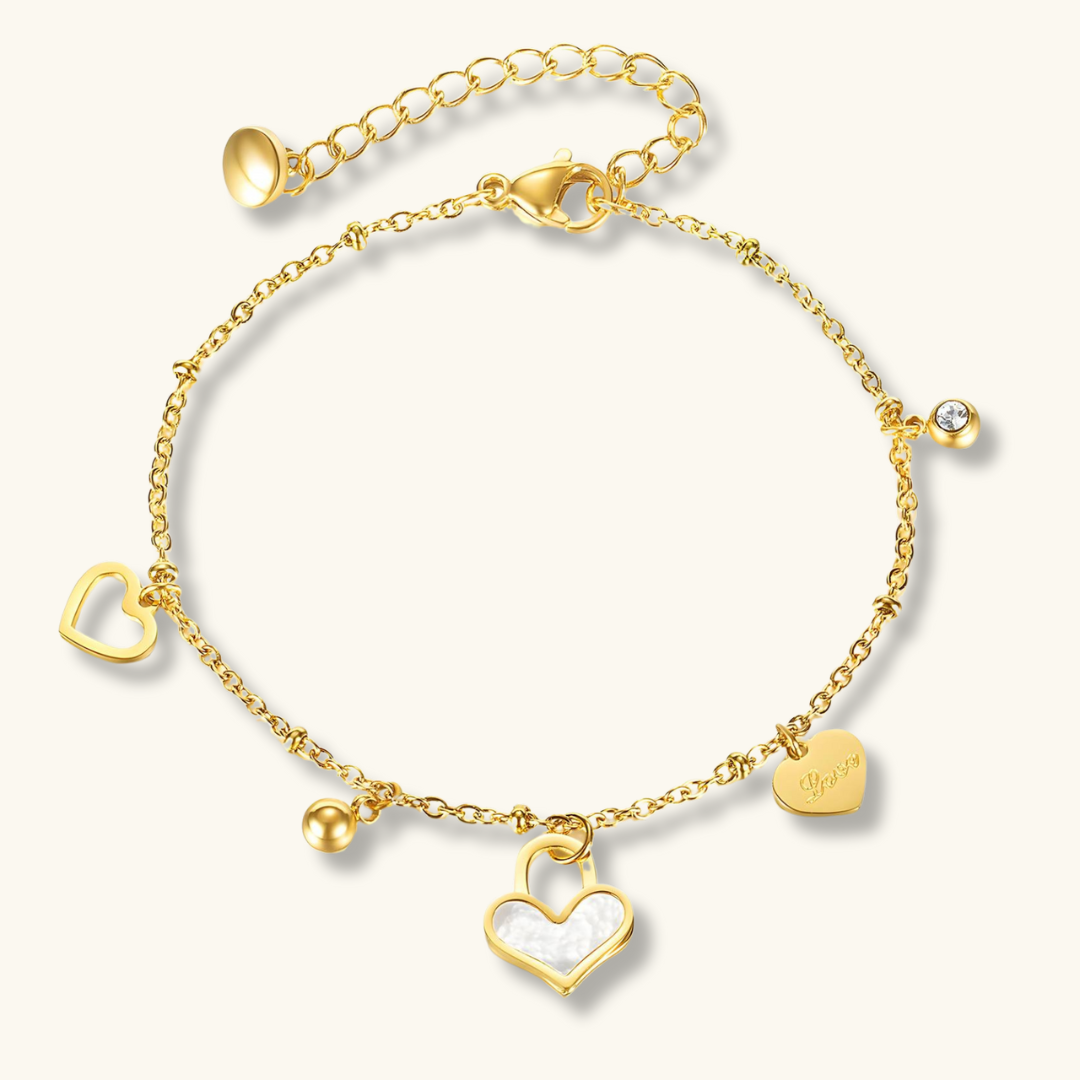 A gold-plated chain bracelet featuring a series of heart charms of varying designs.