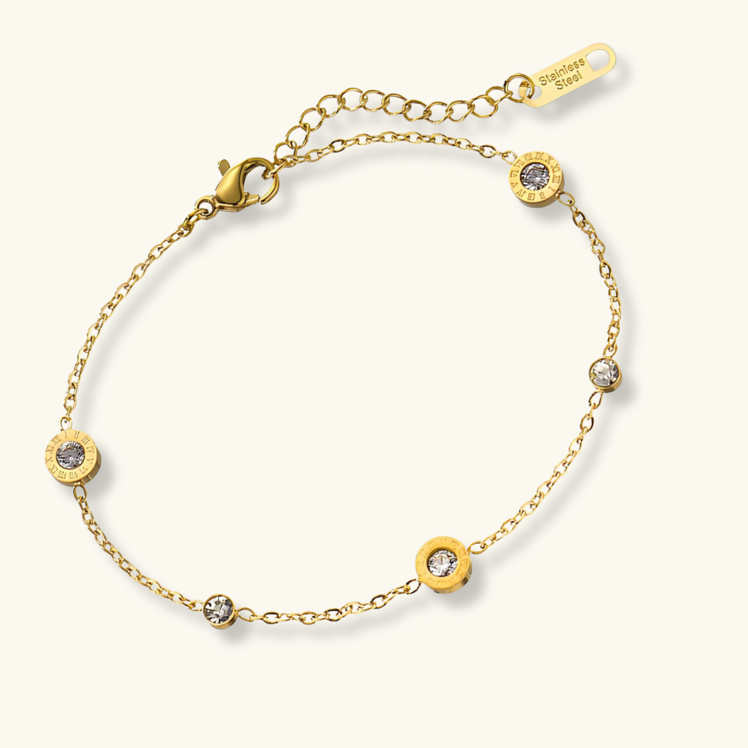 Gold bracelet with Roman numeral detailing and cubic zirconia accents — waterproof and hypoallergenic jewelry by Carolein.