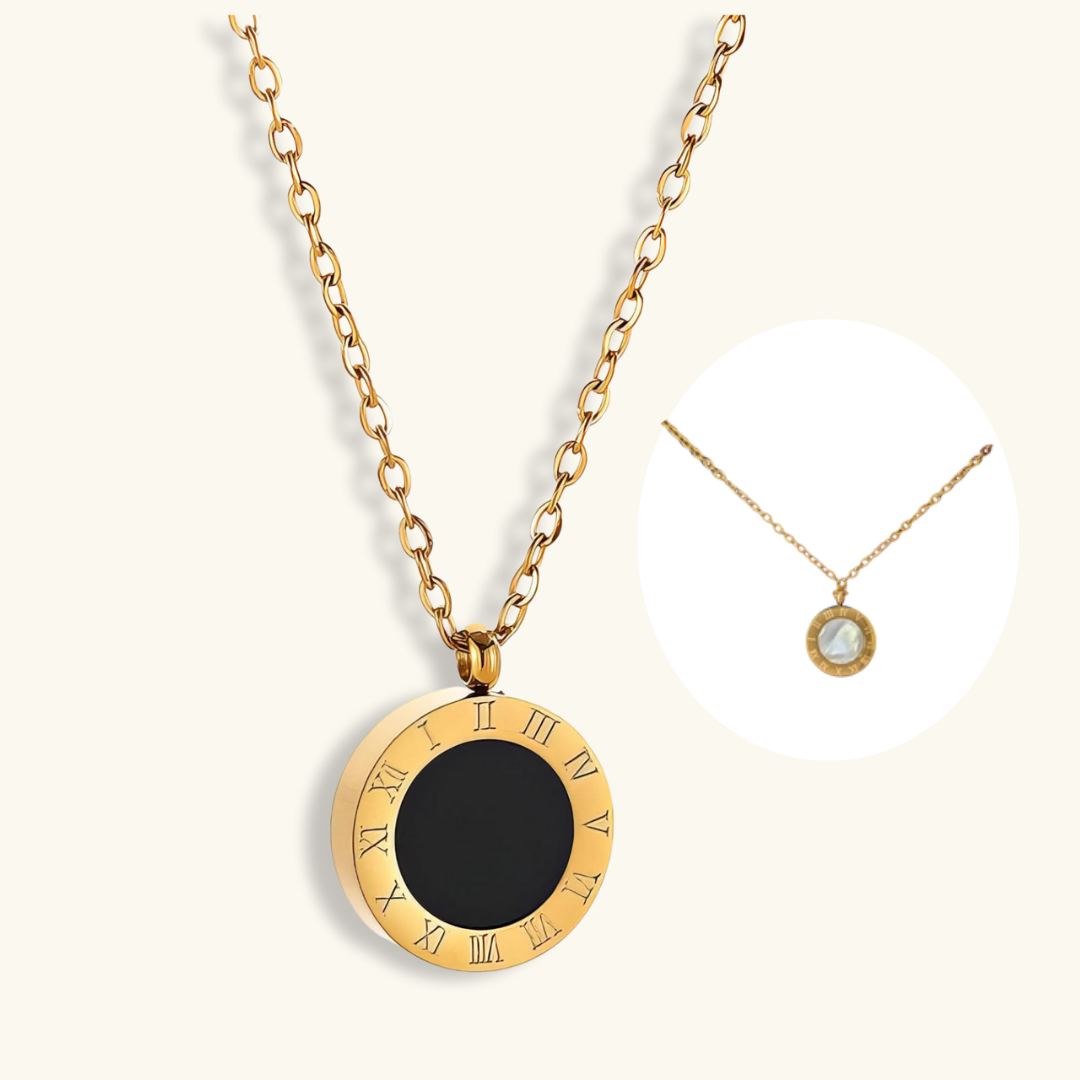 Gold necklace with a black pendant on a white background