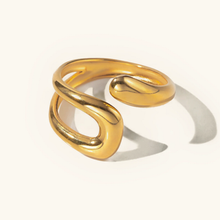 Gold spiral , open gold ring on a white background