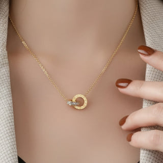 18K Gold plated stainless steel necklace with a two-ring numeral pendant on a woman