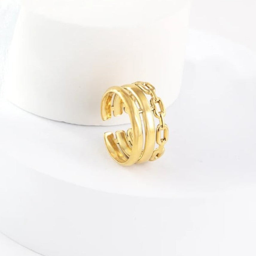 Gold hoop earring on a white background